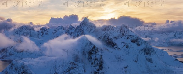 View of snow-covered mountains, Flakstad, sunset, Lofoten, Norway, Europe