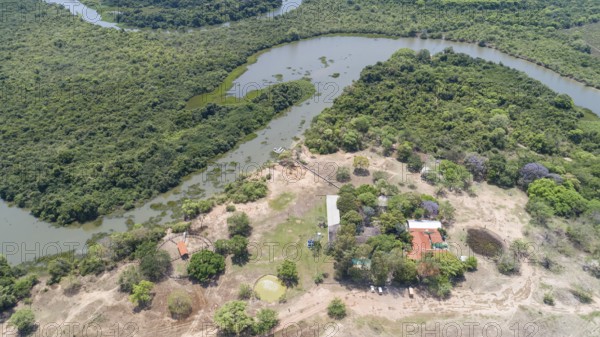 Areal view of typical Pantanal landscape, meandering tropical river through rainforest and deforeste