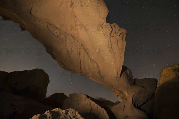 Starry night landscape of a volcanic Rock arch in Tenerife, Canary island, Spain, Europe