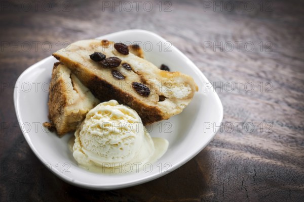 British traditional bread pudding with vanilla ice cream dessert