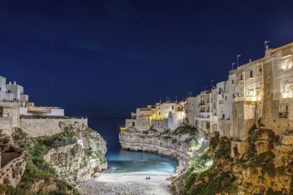 The Llama Monachile bay in Polignano a Mare in Apulia, Italy, at night, Europe