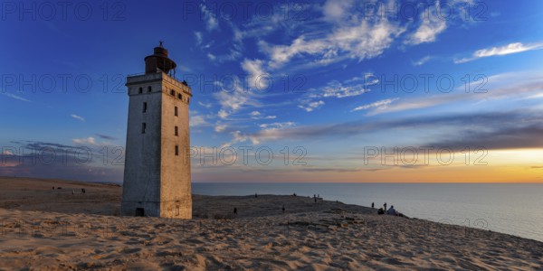 The Rubjerg Knude Fyr lighthouse near Lokken in Denmark in the light of sunset