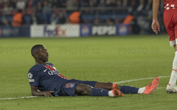 Football match, Ousmane DEMBELE' Paris St Germain exhausted with eyes closed and legs stretched out on the ground, Parc des Princes football stadium, Paris