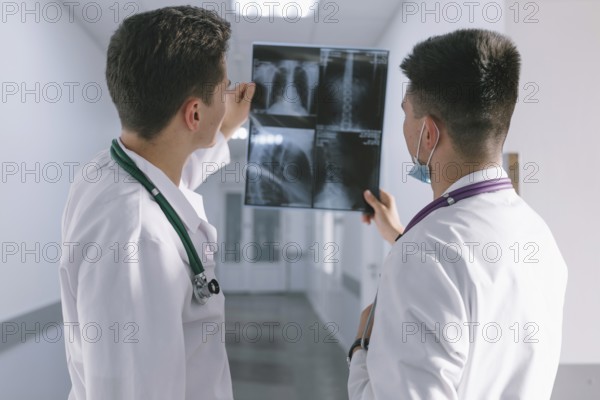 Two male doctors looking x ray. High resolution photo