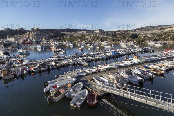 Ilulissat, Greenland, July 03, 2018: Fishing boats at Ilulissat harbor, North America
