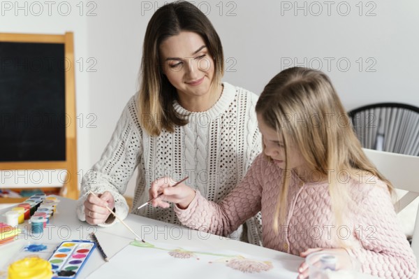 Medium shot girl learning paint
