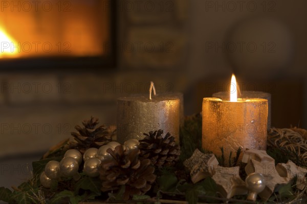 Burning candle on an Advent wreath