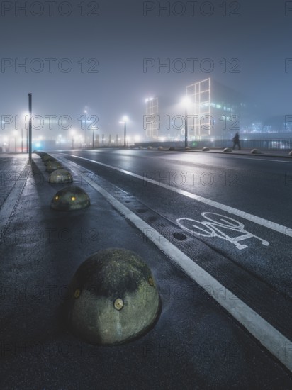 Empty street with Berlin main station in the fog, night, Berlin, Germany, Europe