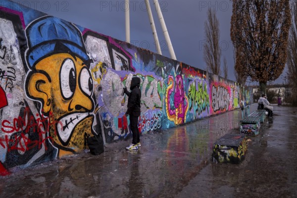 Germany, Berlin, 02. 01. 2022, Sunday afternoon in Mauerpark, graffiti wall, sprayer, rainy day, Europe