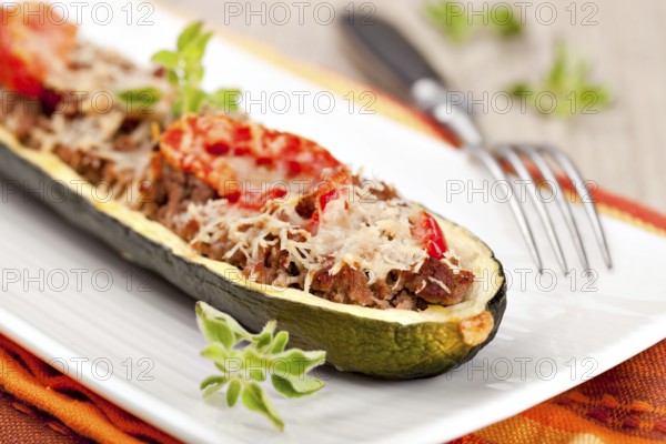 Zucchini halves stuffed with minced meat and vegetable