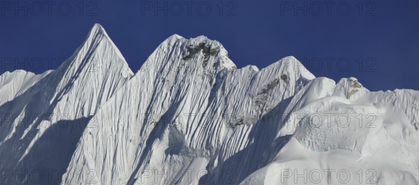 Mountain covered by glacier. Sharpe ridge. Scene in the Everest National Park Nepal