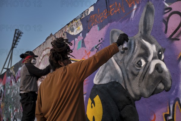 Germany, Berlin, 30.10.2022, graffiti wall in Mauerpark, work by graffiti artist Eme Freethinker, dog, Europe
