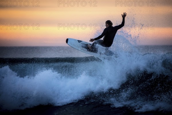 Bells Beach, Australia, January 30 2017: Surfers in action at the iconic Bells Beach on a summer morning at sunrise near Torquay, Victoria, Australia, Oceania