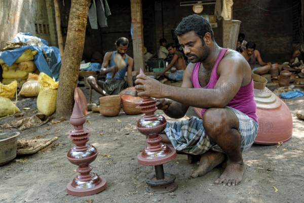 Engraver making copper gopura kalasam in Kumbakonam, Tamil Nadu, India, Asia