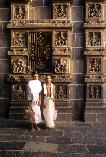 Dikshitar boys in front of karna sculptures in Thillai Nataraja temple in Chidambaram, Tamil Nadu, South India, India, Asia