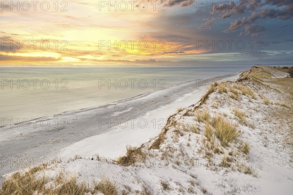 Dramatic sunset at the high dune on the darss. Viewpoint in the national park. Beach, Baltic Sea, sky and sea. Nature shot in Germany