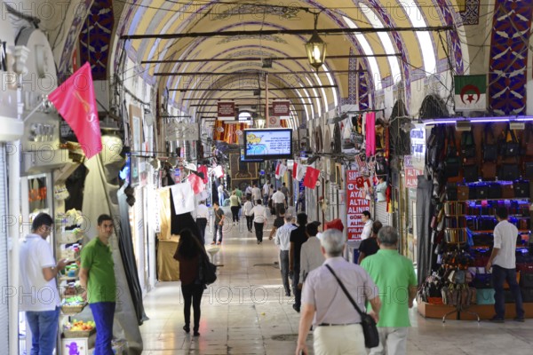 Grand Bazaar, Istanbul, Turkey, Asia, Long corridor of the covered market with numerous shops on both sides and many shoppers, Istanbul province, Asia