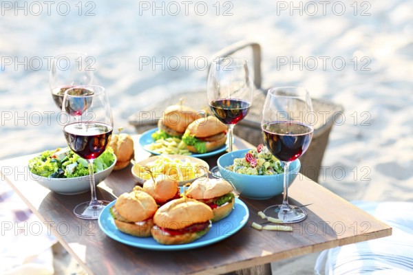 Beach summer picnic table with red wine glasses