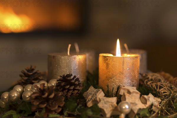Burning candle on an Advent wreath
