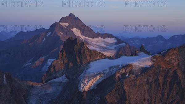 Sunset scene in the Swiss Alps, purple mountains Fleckistock and Stucklistock