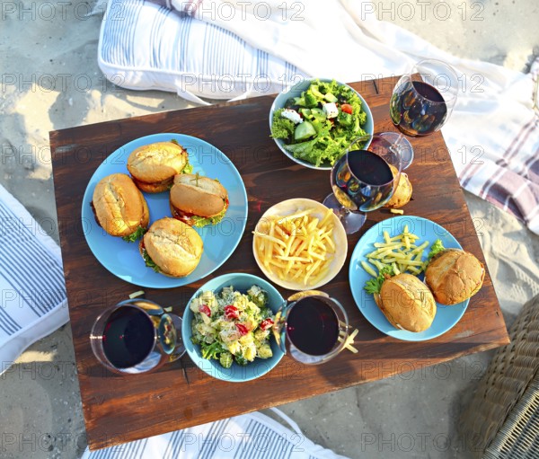 Beach summer picnic table with red wine glasses