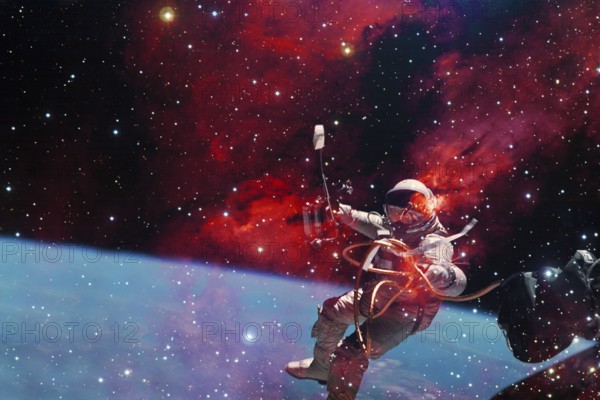 Astronaut. Nebula, cluster of stars in deep space. Science fiction art. Elements of this image furnished by NASA