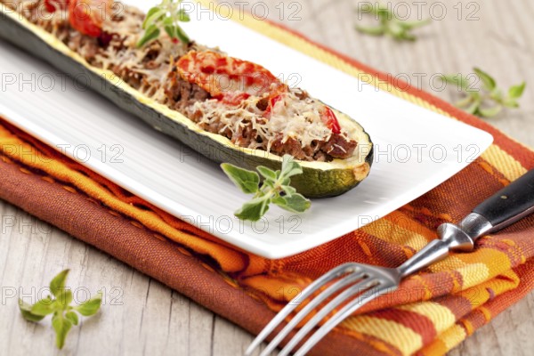 Zucchini halves stuffed with minced meat and vegetable