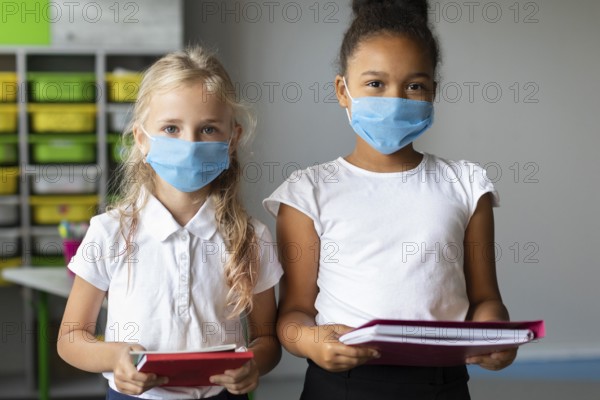 Little girls wearing medical masks class