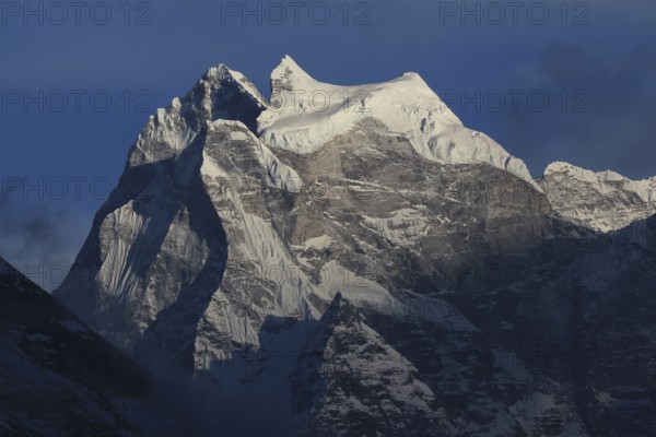 Majestic peak of Kangtega at sunset