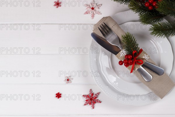 Christmas table setting on white wooden table.Christmas card template