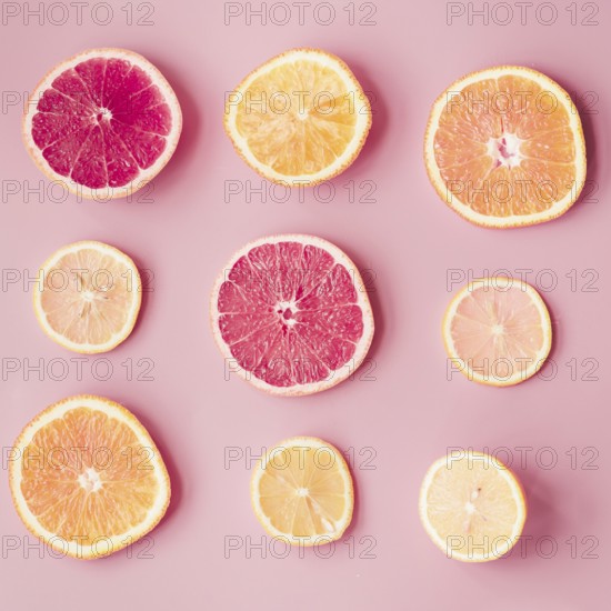 slices fresh citrus fruits pink background. Resolution and high quality beautiful photo