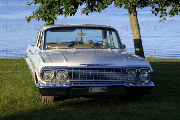 American classic car, Chevrolet Bel Air from 1963, behind the lake Glafsfjorden, Arvika, Värmland, Sweden, Europe