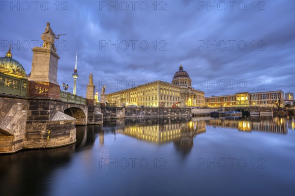 The rebuilt Berlin City Palace with the TV Tower at dusk