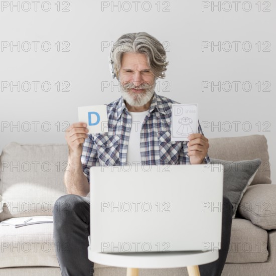 Teacher showing flash cards laptop