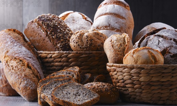Composition with assorted bakery products in wicker basket