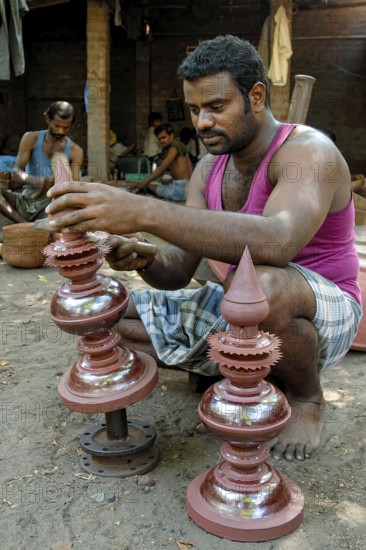 Engraver making copper gopura kalasam in Kumbakonam, Tamil Nadu, India, Asia