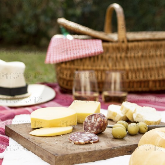 Wooden board with picnic goodies