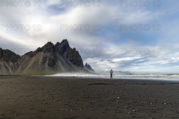 Iceland, Vestrahorn, woman walking on the beach, sea, wind and weather, walk, loneliness, Europe