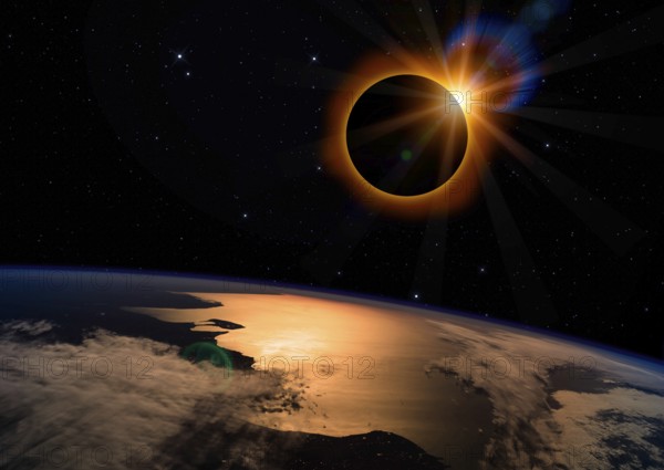 Solar eclipse with orange halo over the planet Earth, on dark starry sky