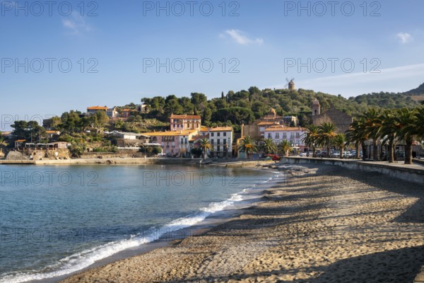 Collioure view from the beach with the Mill on the top of the village