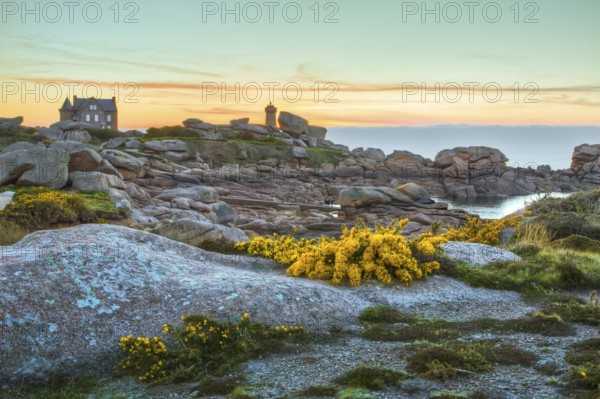 Rock formation and lonely house on the Cote de Granit Rose, Brittany, France, Europe