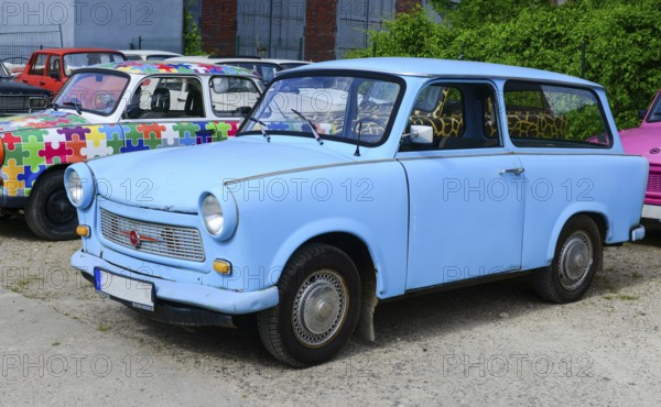 The Trabant is a car that was produced by former East German auto maker VEB Sachsenring Automobilwerke Zwickau in Zwickau, Saxony. It was the most common vehicle in East Germany, and was also exported to countries both inside and outside the eastern bloc. It was advertised as having room for four adults and luggage in a compact and durable shell, and being relatively fast