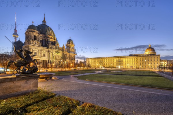The Lustgarten in Berlin in front of sunrise with the TV Tower, the Cathedral and the City Palace