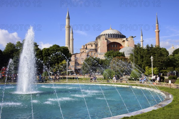 Byzantine architecture of the Hagia Sophia (The Church of the Holy Wisdom or Ayasofya in Turkish) and a park with fountain tranquil scenery in Istanbul, Turkey, Asia