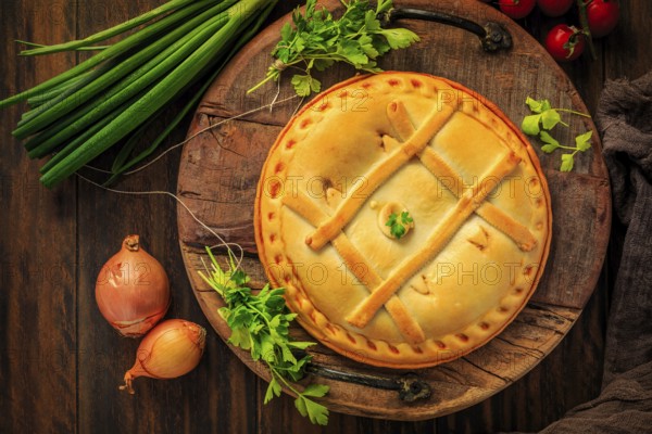 Empanada Gallega - traditional pie stuffed with tuna, Galician and Spanish cuisine. Tart with tuna and vegetables