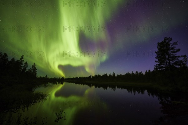 Northern Lights (Aurora borealis) over a lake, Norrbotten, Lapland, Sweden, September 2014, Europe