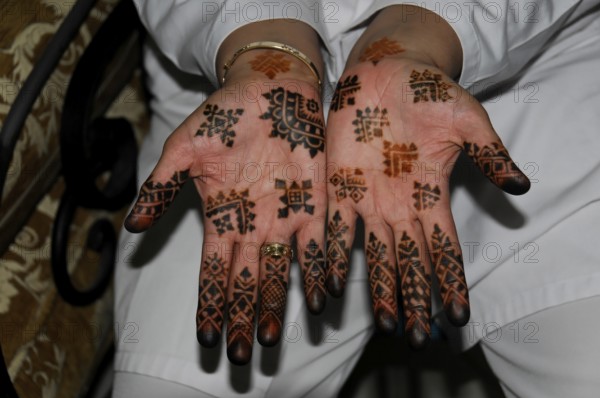 Marrakech, Opened hands show complex, traditional henna designs, Marrakech, Morocco, Africa