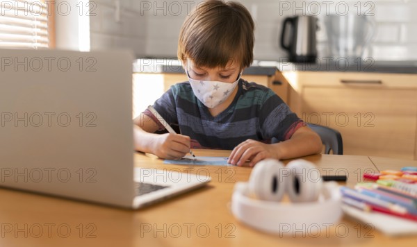 Front view boy learning from virtual classes