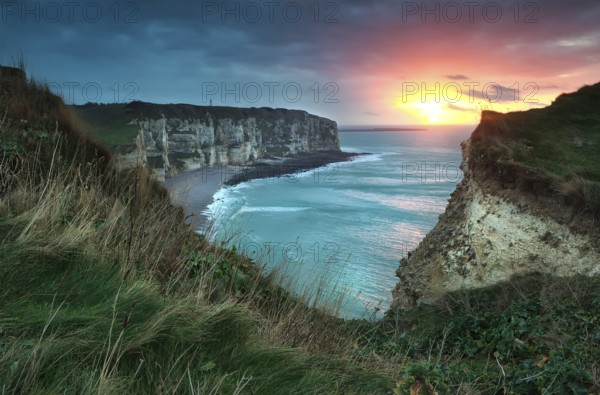 Warm sunset over cliffs and ocean, Etretat, France, Europe