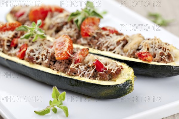 Zucchini halves stuffed with minced meat and vegetable